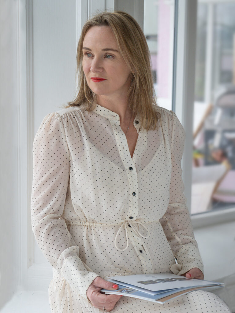 Lisa Curran, director of Currans Unique, with a copy of her book, 25 Unique Homes of Chester